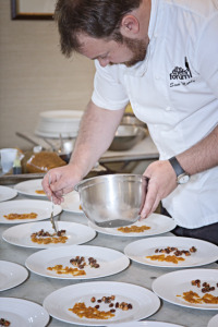 Sam Moody of The Bath Prioiry plating his Bath Chaps starter