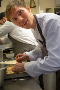 Student making canapes
