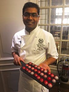 Biju serving canapes on Row and Sons boards